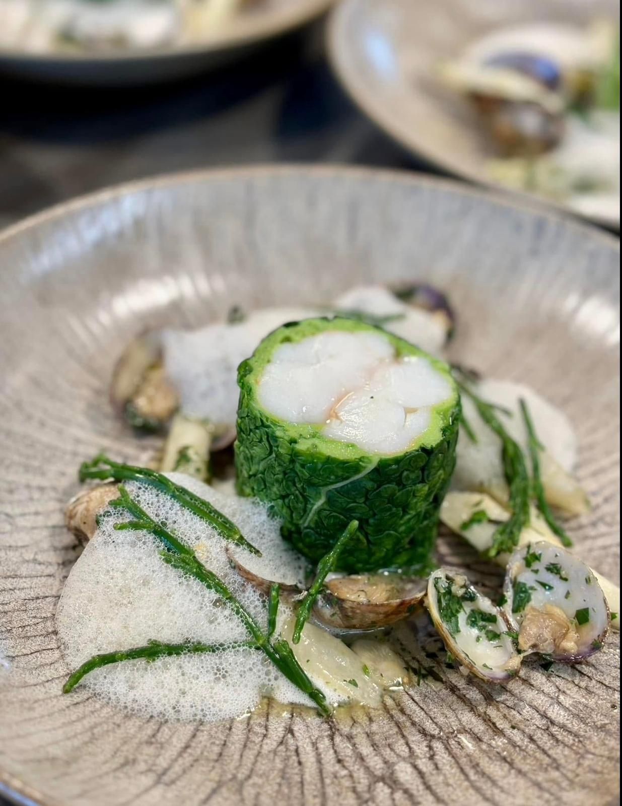 Cod wrapped in savoy cabbage with clams, sea beans and a light foam (opens Rosolini on Instagram)
